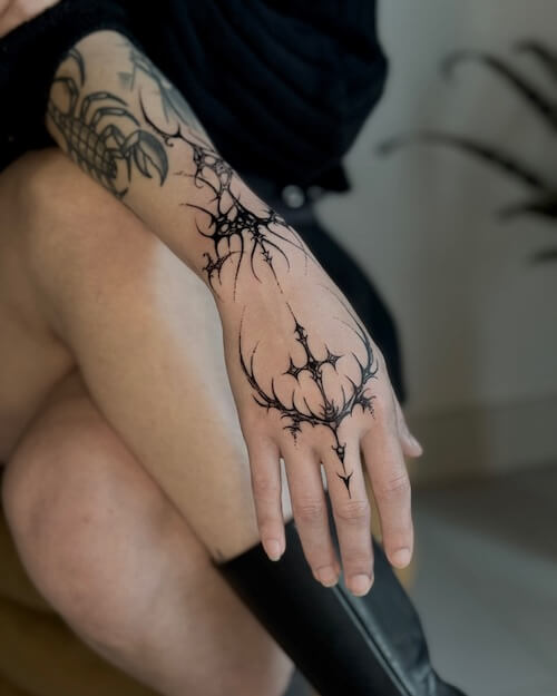 dark feminine tattoo