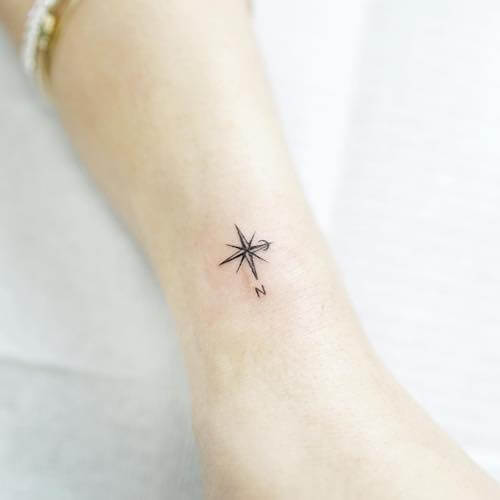 feminine compass tattoo women