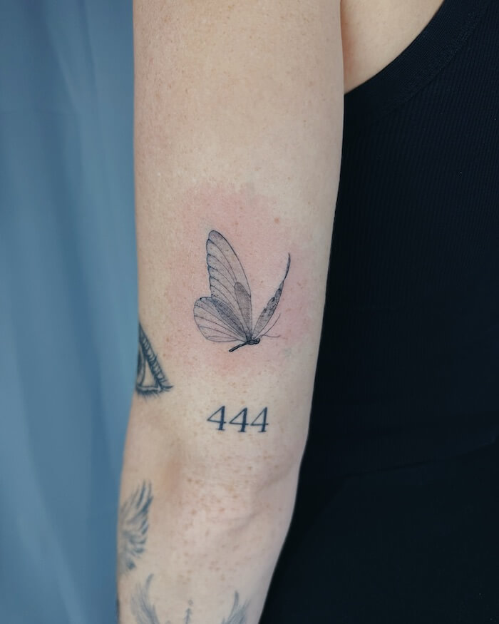small butterfly tattoo women