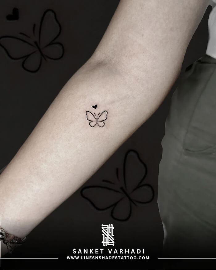 small butterfly tattoo women