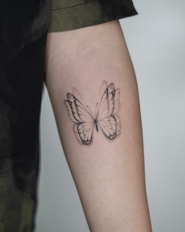 Multi-Layered Black Butterfly Upper Arm Tattoo