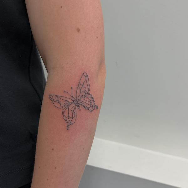 Delicate Black Line Butterfly Arm Tattoo