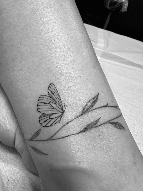 Ankle Butterfly And Vine Entwined Tattoo