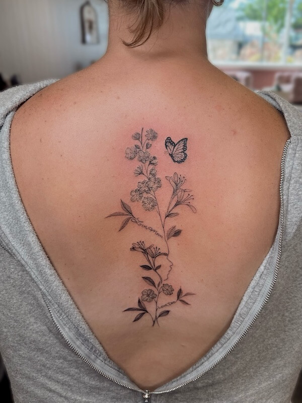 Floral And Flying Butterfly Spine Tattoo
