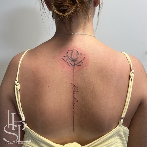 Lotus And Script Spine Tattoo
