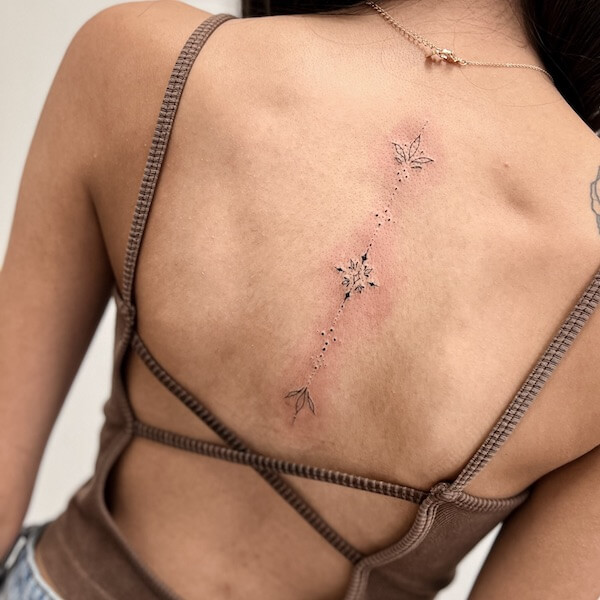 Decorative Fine Line Lotus Spine Tattoo