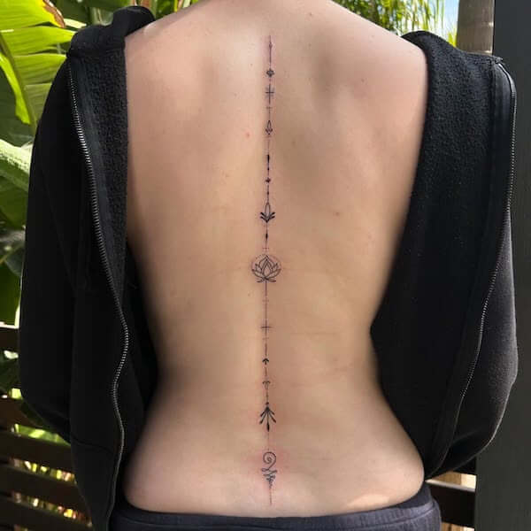Elegant Lotus Spine Tattoo