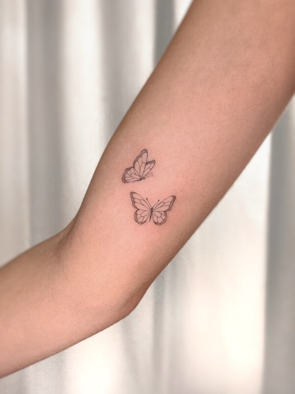 Two Minimalist Butterflies On Upper Arm