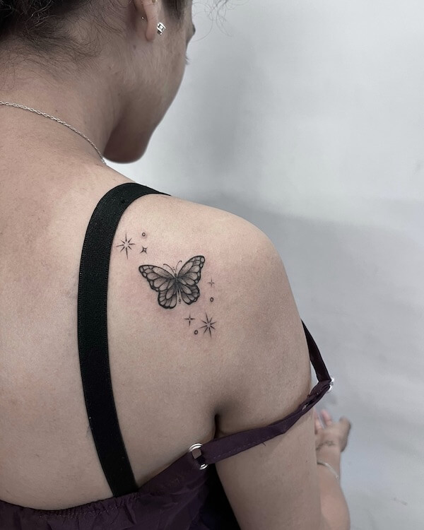Butterfly And Stars Tattoo On The Back Of The Shoulder