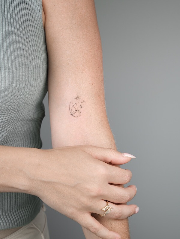 Upper Arm Minimalist Fine Line Butterfly And Stars Tattoo