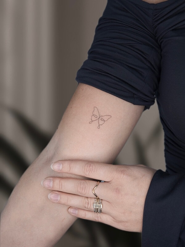 Upper Arm Fine Line Minimalist Butterfly Tattoo