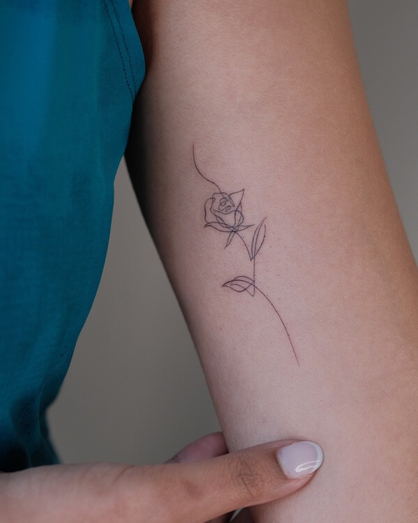 Delicate Rose Tattoo On The Inner Upper Arm