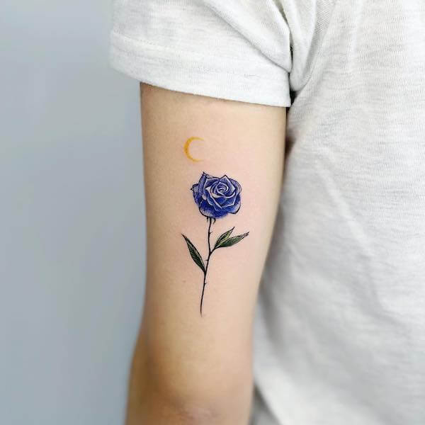 Blue Rose Tattoo On The Back Of The Upper Arm