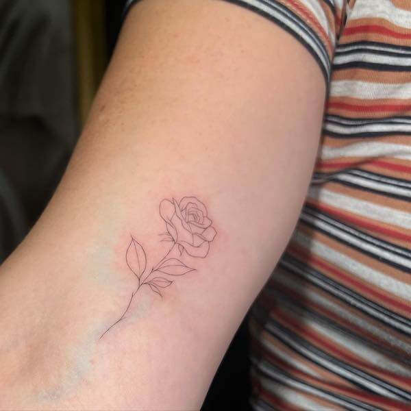 Minimalist Line Rose Tattoo On Upper Arm