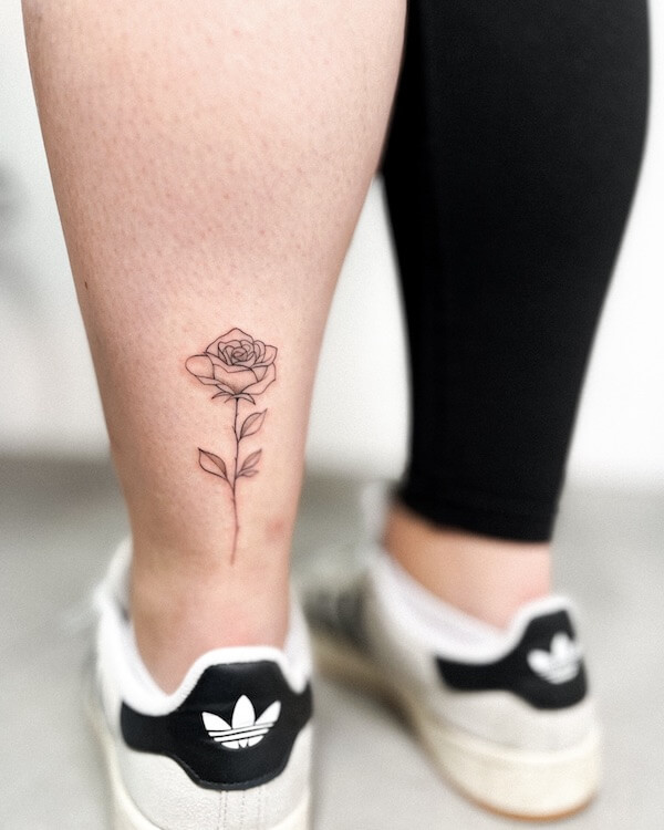 Rose Tattoo On The Back Of The Ankle