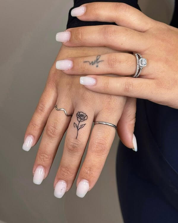 Delicate Rose Finger Tattoo
