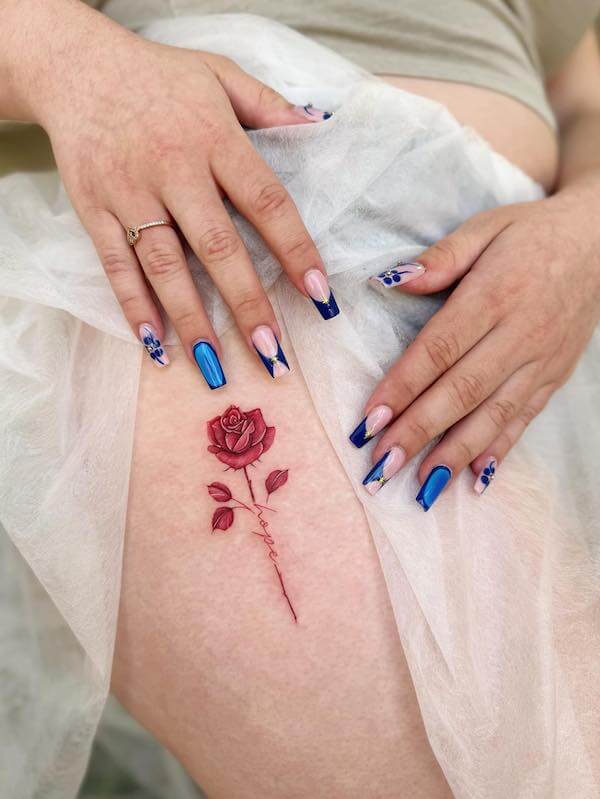 Red Thigh Rose Tattoo