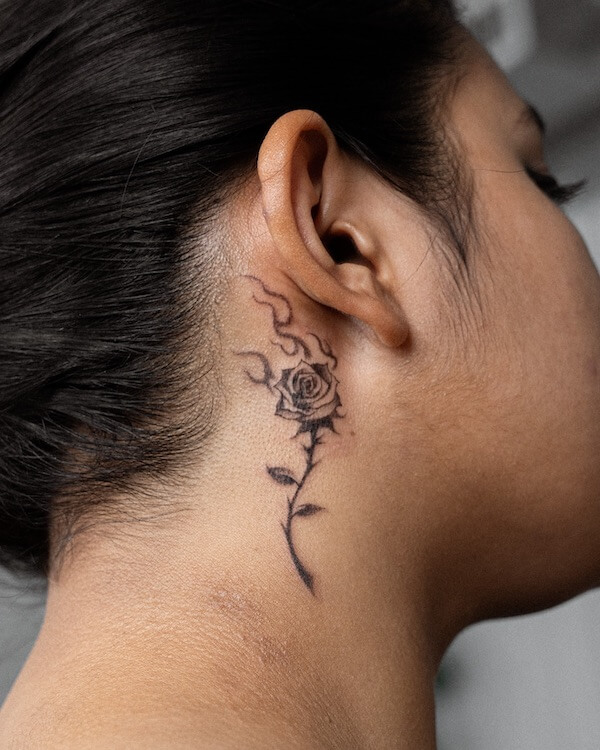 Black Rose And Flame Behind The Ear Tattoo
