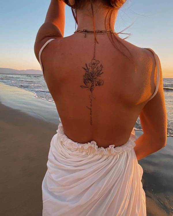 Floral And The Word Spine Tattoo