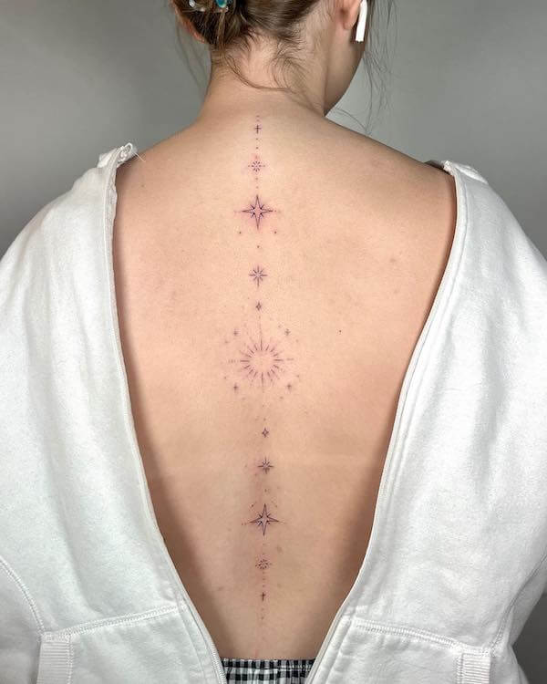 Elegant Sun And Stars Spine Tattoo