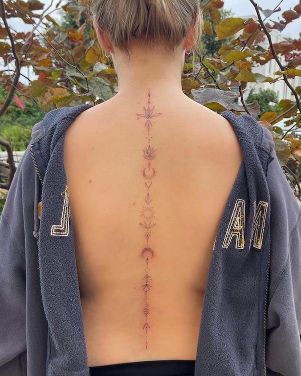 Sun Moon And Lotus Spine Tattoo