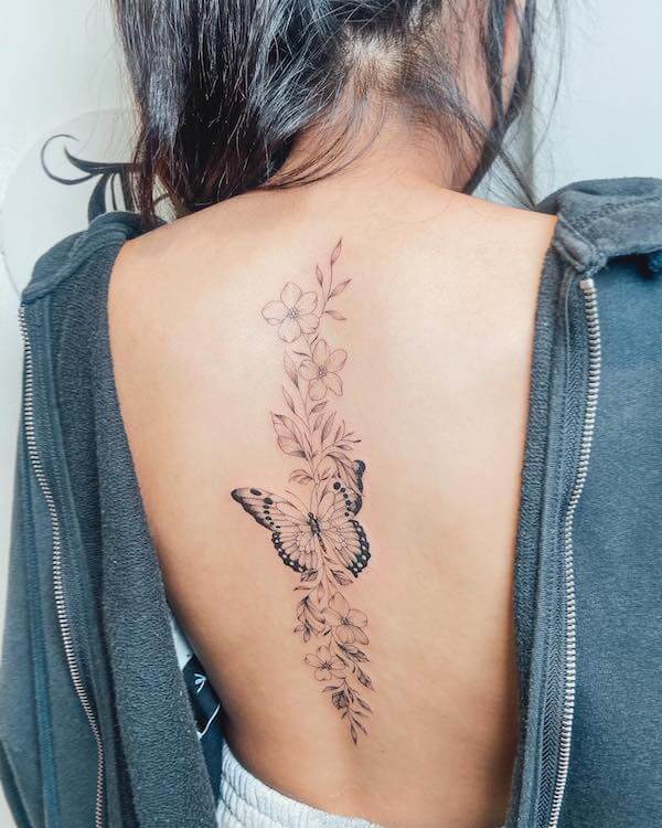 Beautiful And Elegant Butterfly And Floral Spine Tattoo